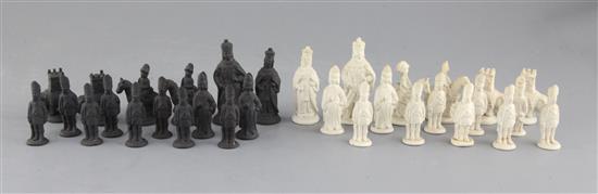 A Castleford type biscuit porcelain and basalt chess set, kings 3.25in.